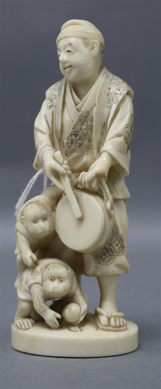 A Japanese ivory okimono of a monkey trainer, early 20th century height 13cm